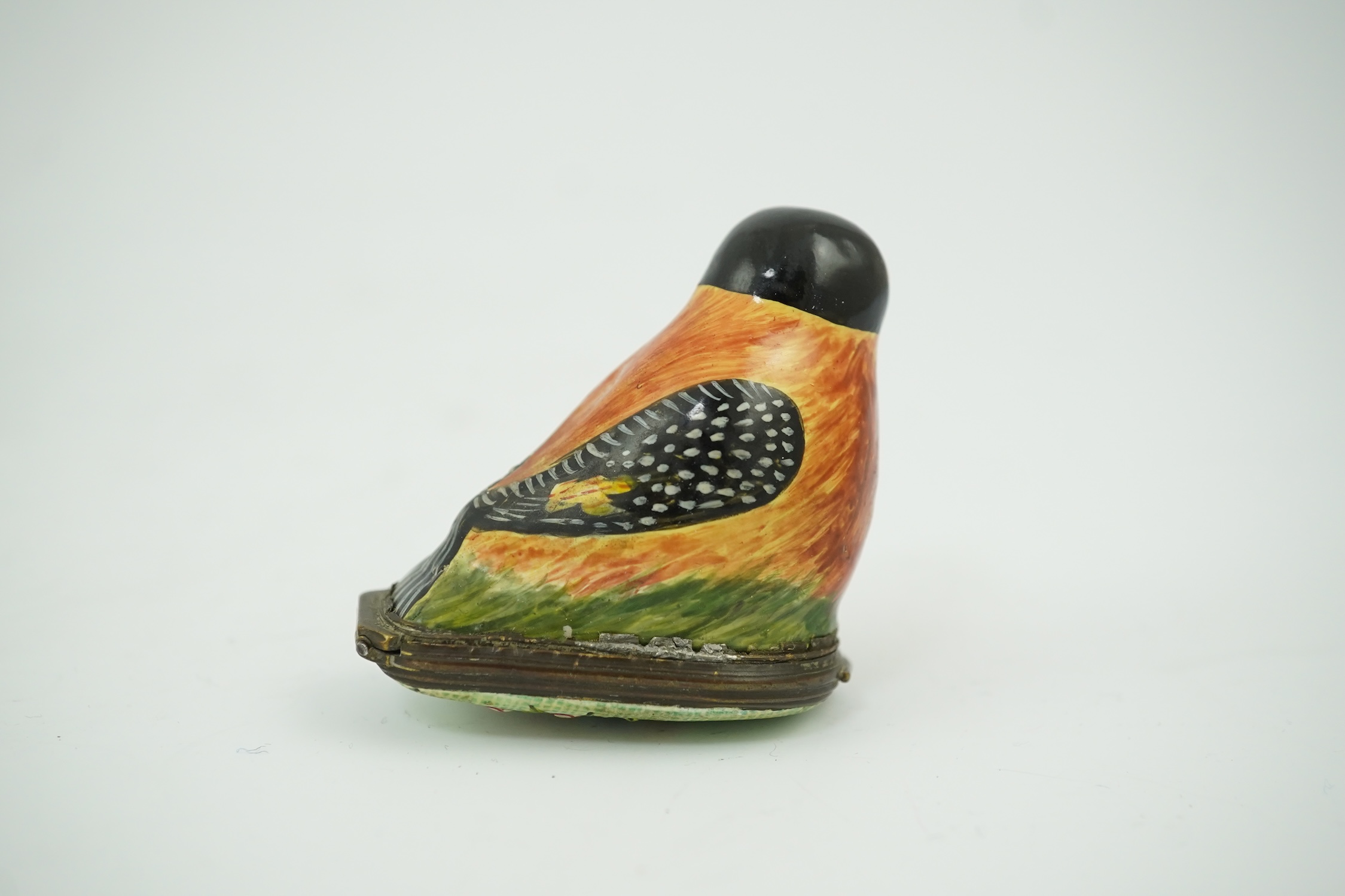 An 18th century South Staffordshire (Bilston) enamel box modelled as a bird with floral decorated cover, 4.5cm high. Condition - fair